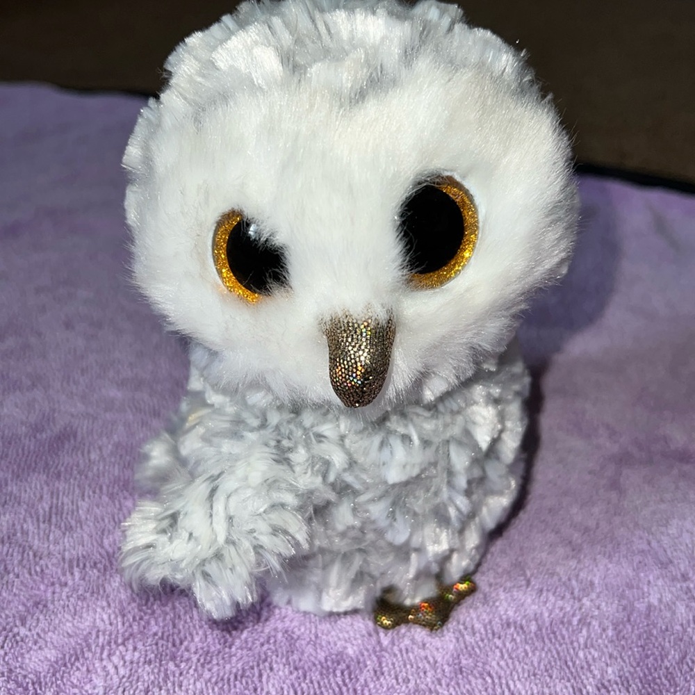 TY beanie baby owlette colors grey, white, and some light brown.